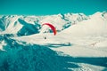 Paraglider tandem flying over Gudauri . Colorful parachute. Active lifestyle, Extreme hobbies. Paragliding Georgia. Adventure trav