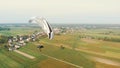 Paraglider Tandem Paramotor flying in the air - countryside of Poland