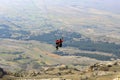 Paraglider tandem taking off mountain Royalty Free Stock Photo