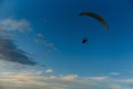 Paraglider with yellow parachute taking off Royalty Free Stock Photo