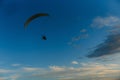 Paraglider with yellow parachute taking off Royalty Free Stock Photo