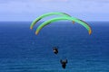 Paragliders above the sea