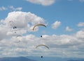 Paragliders on a background of blue clody sky Royalty Free Stock Photo