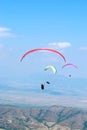 Paragliders on a background of blue sky