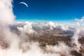 Paragliders flying above the clouds Royalty Free Stock Photo