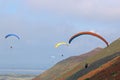 Paragliders flying above Rhossili