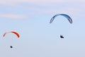 Paragliders flying in a blue sky Royalty Free Stock Photo