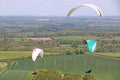 Paragliders flying from Combe Gibbet, England