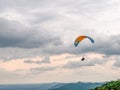 Paragliders flying over mountains