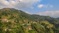 Paragliders flying over Sarangkot in Pokhara, Nepal