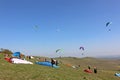 Paragliders flying wing at Milk Hill