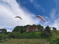 Paragliders flying in the sky over the vineyards of Trzesacz, Poland