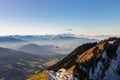Paragliders flying straight to a valley over a hut Royalty Free Stock Photo
