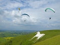 Paragliders flying at Westbury in Wiltshire