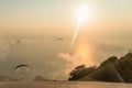 Paragliders free soaring in cloudless sky over sea and Blue Lagoon in Oludeniz, Turkey Royalty Free Stock Photo