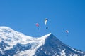 Paragliders looking for thermals amongst the snow caps of the Monte Blanc Massif, Chamonix, Royalty Free Stock Photo