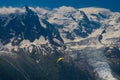 Paragliders looking for thermals amongst the snow caps of the Monte Blanc Massif, Chamonix, Royalty Free Stock Photo