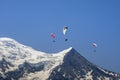 Paragliders looking for thermals amongst the snow caps of the Monte Blanc Massif, Chamonix Royalty Free Stock Photo