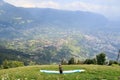 Paragliders prepare for Paragliding in front of Merano panaroma in South Tyrol