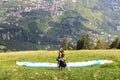 Paragliders prepare for Paragliding in front of Tirol panaroma in South Tyrol