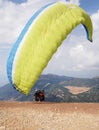 Paragliders preparing the equipment on Babadag for the launching / Ready to fly