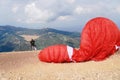 Paragliders preparing the equipment on Babadag for the launching / Ready to fly