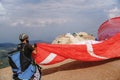 Paragliders preparing the equipment on Babadag for the launching / Ready to fly