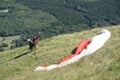 Paragliders preparing for takeoff at the summit of Puy de Dome