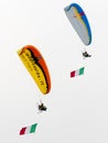 Paragliders showing skill in the sky on a paramotors demonstration Royalty Free Stock Photo