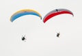 Paragliders showing skill in the sky on a paramotors demonstration Royalty Free Stock Photo