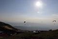 Paragliders in the sky having fun in mountains