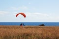 Paragliders tandem at the start, sky divers training by the sea shore Royalty Free Stock Photo