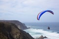 Paragliding above the ocean at Castelejo beach in Portugal