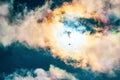 Paragliding adventure sport against bright sun on cloudy sky Royalty Free Stock Photo