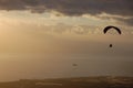 Paragliding backlit flying over coast and sea Tenerife Royalty Free Stock Photo