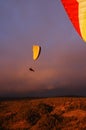 Paragliding backlit flying over mountain in Tenerife Royalty Free Stock Photo