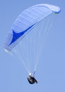 Paragliding in a clear blue sky