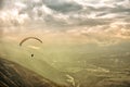 Paragliding among clouds above mountain range Royalty Free Stock Photo