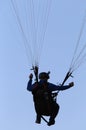 Paragliding flying pilot