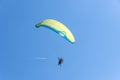 Paragliding, flying in the sky and high passenger airliner jet contrail Royalty Free Stock Photo
