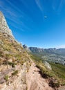 Paragliding from Lions Head with a beautiful view of Table Mountain in Cape Town, South Africa. Lush green trees growing Royalty Free Stock Photo