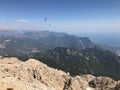 Paragliding in mountains. Freedom to fly in air over mountains with parachute. Paragliding behind blue sky Carpathian Mountains Royalty Free Stock Photo