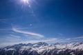 Paragliding over Alps with mountain cliffs covered with snow in Karnten Austria.