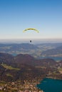 Paragliding over lake and mountains in Alps