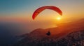 Paragliding Over Mountain at Sunset Royalty Free Stock Photo