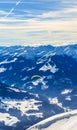 Paragliding over the mountains in winter. Ski resort Hopfgarten Royalty Free Stock Photo