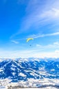 Paragliding over the mountains in winter. Ski resort Hopfgarten Royalty Free Stock Photo