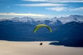 Paragliding over Nahuel Huapi lake and mountains of Bariloche in Argentina, with snowed peaks in the background. Concept of Royalty Free Stock Photo