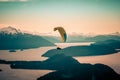 Paragliding over Nahuel Huapi lake and mountains of Bariloche in Argentina, with snowed peaks in the background. Concept of Royalty Free Stock Photo