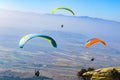 Paragliding over the tops of the mountains